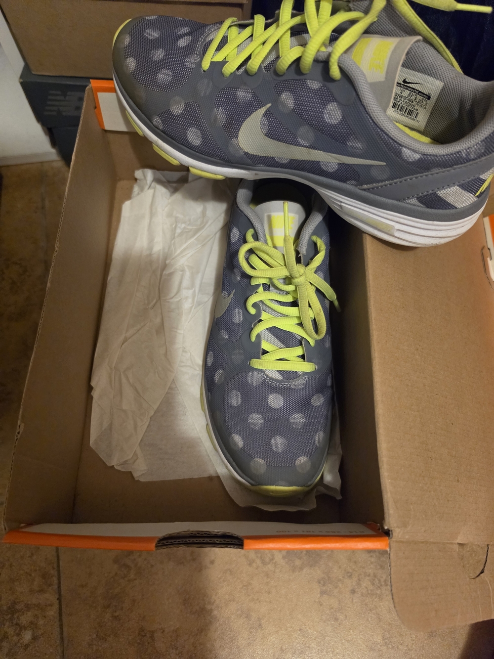 Nike Women's Gray Sneaker with Neon Yellow Accents